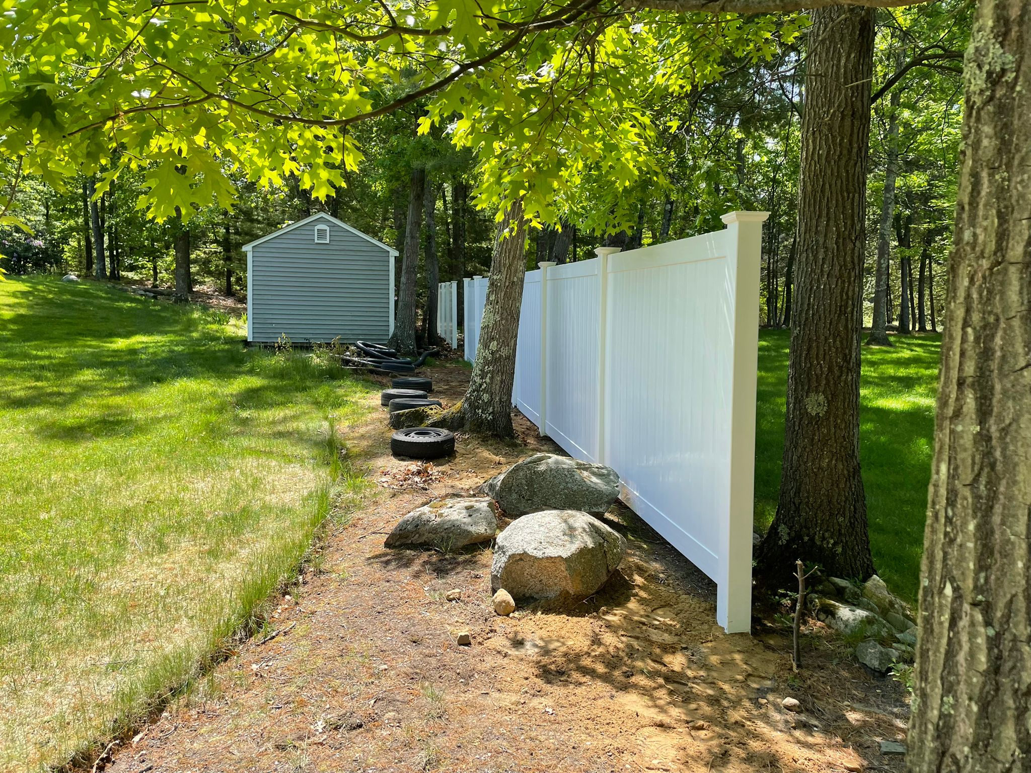 Modern fence made of vinyl, wood, chain link, aluminum
