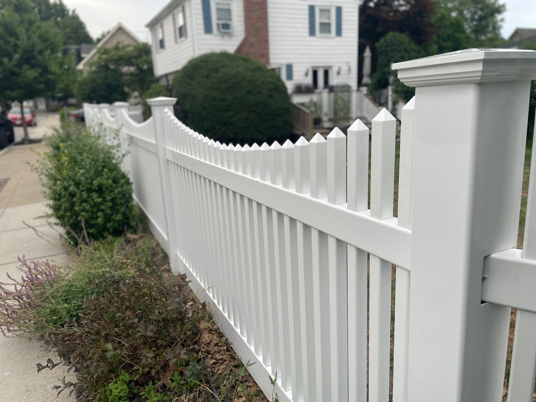Modern fence made of vinyl, wood, chain link, aluminum
